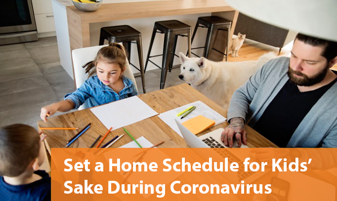 father with two kids work from home at kitchen table